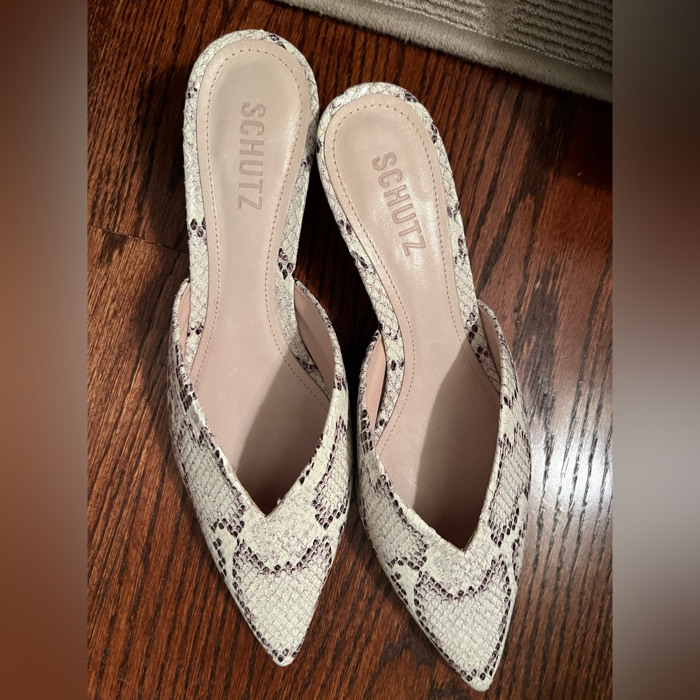 Schutz women’s Charla stone embossed snakeskin leather mules.